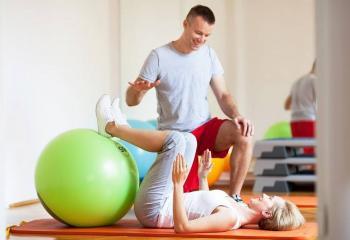 Pilates teacher using swiss balls-FEATURED PICTURE