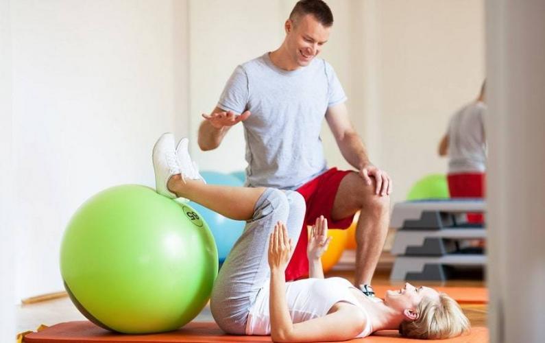 Pilates teacher using swiss balls-FEATURED PICTURE