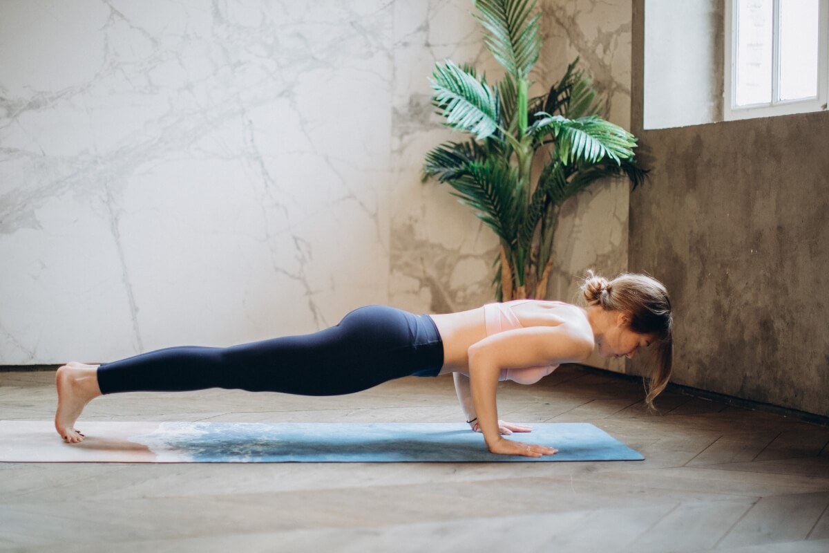 Woman performing Plank Pose
