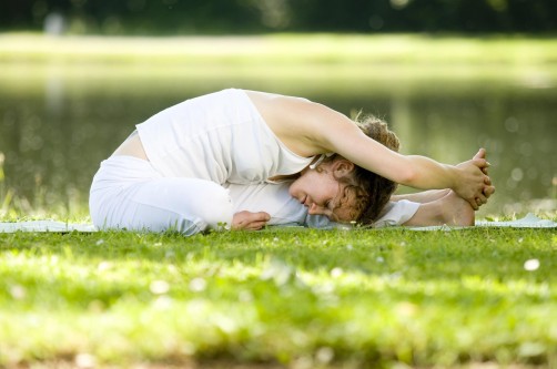 woman stretching for back pain rehab