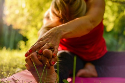 woman stretching for back pain relie