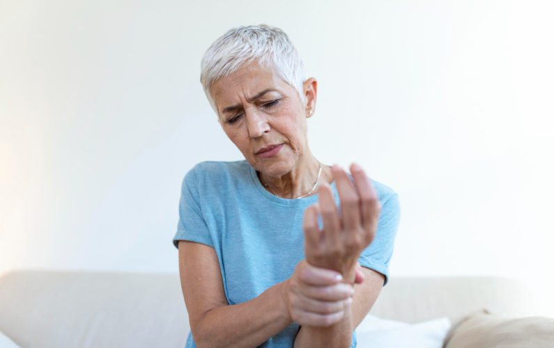 elderly woman suffering from osteoporosis